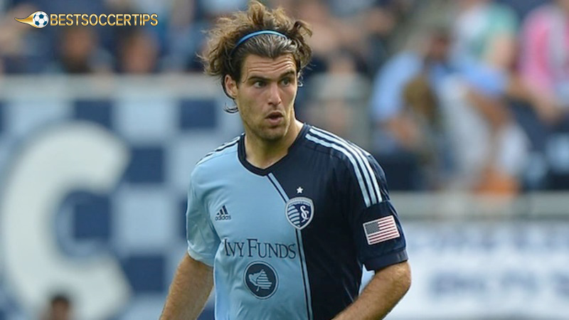 Soccer players with long hair and headband: Graham Zusi